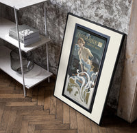 Woman blowing soap bubbles poster in a black frame leaning beside a shelf in a raw-plaster loft