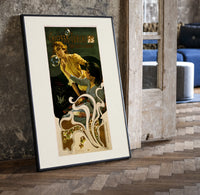 Two women blowing soap bubbles print in a black frame leaning beside a vintage door on parquet