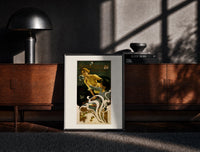 Black-framed Two women blowing soap bubbles print on a moody console with designer coffee-table books
