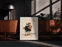Black-framed Two children holding Santa doll print on a moody console with designer coffee-table books