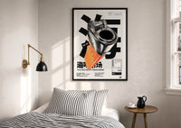 Chrome Salmon Lighter Seafood Market print in a black frame above a bed with striped linens