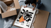 Chrome Salmon Lighter Seafood Market framed print being unpacked from protective bubble wrap and a box