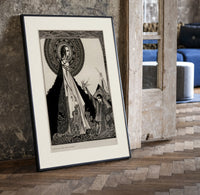 ethereal woman and shrouded man print in a black frame leaning beside a vintage door on parquet