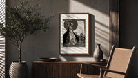ethereal woman and shrouded man poster framed above a fluted sideboard beside an olive tree
