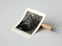 Rolled chained man in dungeon catacomb poster beside its crush-resistant kraft shipping tube
