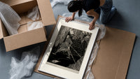 chained man in dungeon catacomb framed print being unpacked from protective bubble wrap and a box
