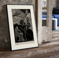 Man carrying pale woman, seated figure print in a black frame leaning beside a vintage door on parquet