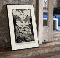 Mountain valley landscape with figure print in a black frame leaning beside a vintage door on parquet