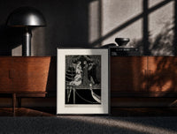 Black-framed Elegant Venetian noblewoman with courtiers print on a moody console with designer coffee-table books