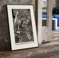Ornate woman with flitting faces print in a black frame leaning beside a vintage door on parquet