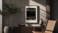 Buried man in coffin underground poster framed above a fluted sideboard beside an olive tree