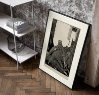 Snarling ape attacking woman poster in a black frame leaning beside a shelf in a raw-plaster loft
