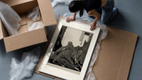 Snarling ape attacking woman framed print being unpacked from protective bubble wrap and a box