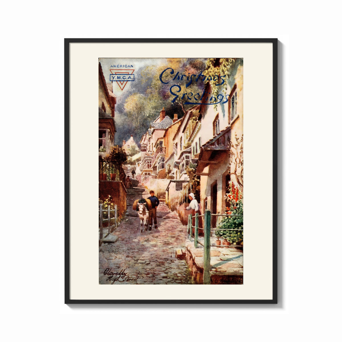 Framed Cobbled village street with boy and donkey print shown as a bold statement piece on a clean gallery wall
