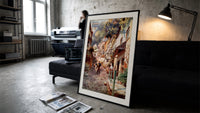 Cobbled village street with boy and donkey print in a slim black frame leaning on a dark sofa in a concrete print studio