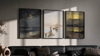 Coastal seascapes with sailing ships triptych in three black frames on a grey wall above a leather sofa