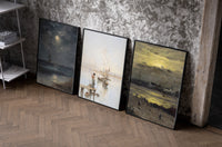 Coastal seascapes with sailing ships set of three black-framed prints leaning against a raw-plaster wall