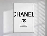 Chanel logo with quote poster in a slim frame on a bright wall with soft window light