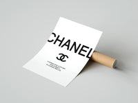 Rolled Chanel logo with quote poster beside its crush-resistant kraft shipping tube