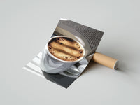 Gently curled Coffee and an Open Book print beside its protective shipping tube
