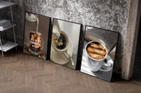Coffee Cup Set of 3 as black-framed prints leaning against a raw-plaster wall