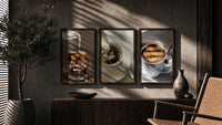 Coffee Cup Set of 3 in walnut frames above a sideboard in a warm room