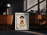 Black-framed Smiling person washing hands in basin print on a moody console with designer coffee-table books