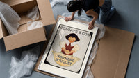 Smiling person washing hands in basin framed print being unpacked from protective bubble wrap and a box