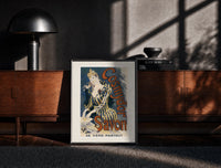 Black-framed Woman washing hands in basin print on a moody console with designer coffee-table books