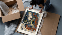 Woman washing hands in basin framed print being unpacked from protective bubble wrap and a box