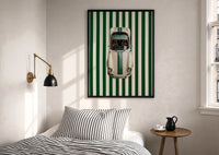 911 Targa Racing Stripes print in a black frame above a bed with striped linens