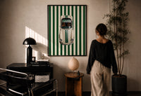 911 Targa Racing Stripes print in a black frame on a sunlit plaster wall, a woman looking on beside a mushroom lamp