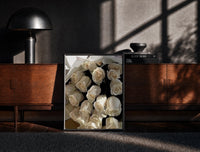 Black-framed Cream Rose Bouquet print on the floor in front of a dark wooden console