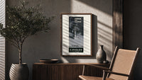 Perfume bottle on pedestal poster framed above a fluted sideboard beside an olive tree