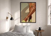 Pale Green Platform Sandals print in a black frame above a bed with striped linens