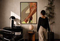 Pale Green Platform Sandals print in a black frame on a sunlit plaster wall, a woman looking on beside a mushroom lamp
