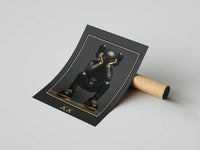 Crouching KAWS figure in a gold-bordered frame on charcoal with XX eye detail next to a rolled print