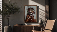 Dangling Jewelry Over the Face poster framed above a fluted sideboard beside a potted tree