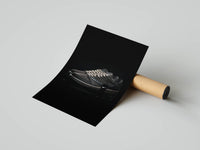 Side profile dark mocha sneaker with cream rope laces on a black background shown as a rolled poster