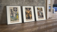 Three 1909 tarot cards three-piece set leaning on parquet beside a vintage loft door
