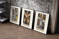 Three 1909 tarot cards set of three black-framed prints leaning against a raw-plaster wall