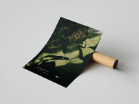 Dense tropical leaves on a dark background with a Nike swoosh and motivational text, unrolled beside a cardboard tube