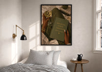 Discipline Today Freedom Tomorrow print in a black frame above a bed with striped linens