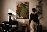Discipline Today Freedom Tomorrow print in a black frame on a sunlit plaster wall, a woman looking on beside a mushroom lamp
