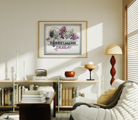 Woman smelling lilac flowers print in an oak frame above a mid-century book console with a vintage radio