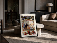 Victorian women in ornate dresses print in a black frame leaning on a travertine table in a sunlit lounge