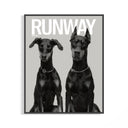 Black framed monochrome poster of two Doberman Pinschers wearing chain collars in elegant standing poses