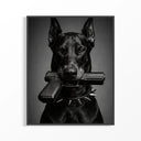 Black and white framed artwork showing a fierce Doberman dog holding a pistol in its mouth.