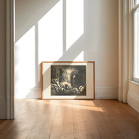 Radiant angel guiding two figures print in an oak frame on a sunlit wood floor beneath tall window light