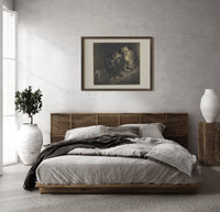 Crowned giant with serpent coiled print in a dark wood frame above a rattan bed on a plaster wall